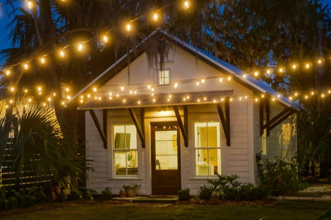 small white bunkie cottage